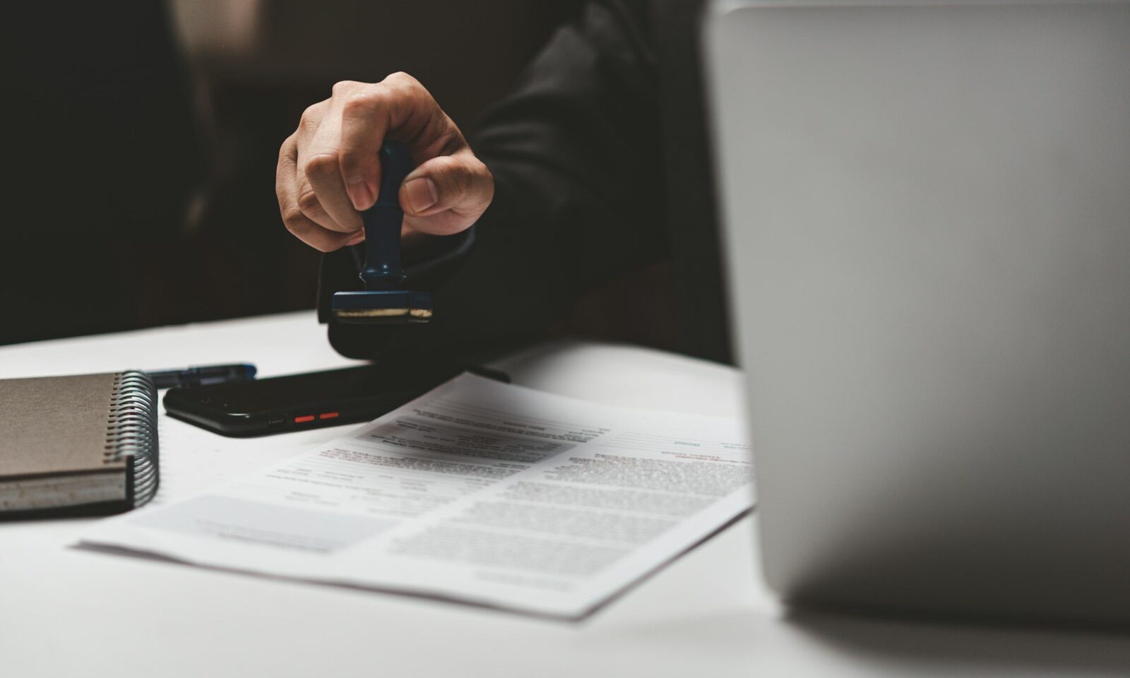 businessman-hand-stamping-approved-on-certificate-document-contract-in-office-
