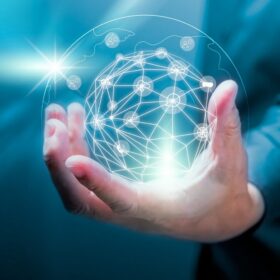 Businessman holding of global data network and social network of databases