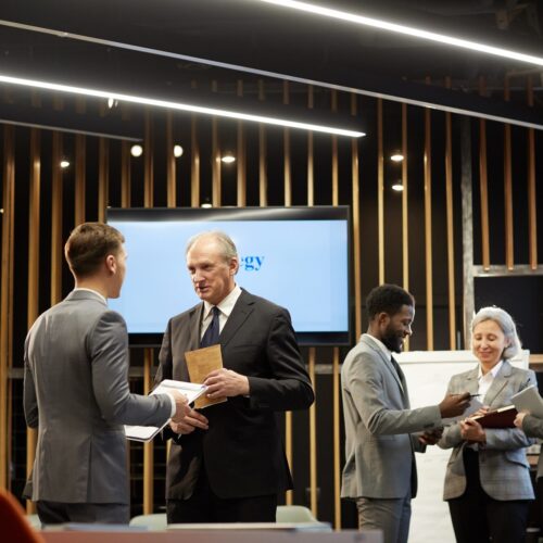 Discussing business presentation in conference room