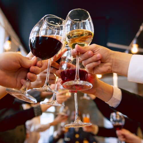 Happy co-workers celebrating while company party and corporate event